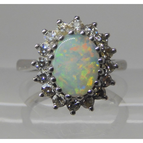 526 - AN 18CT WHITE GOLD OPAL AND DIAMOND RING