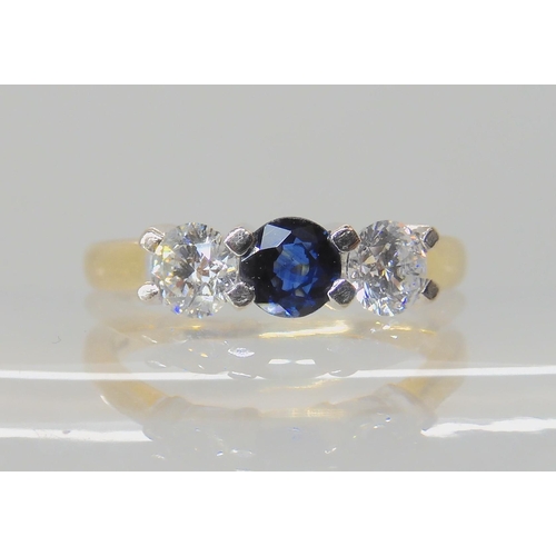 536 - AN 18CT GOLD SAPPHIRE AND DIAMOND THREE STONE RING