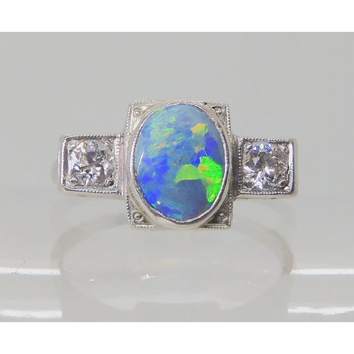 537 - AN 18K WHITE GOLD OPAL AND DIAMOND RING