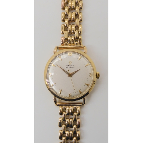 674 - A 9CT GOLD OMEGA AUTOMATIC WRISTWATCH