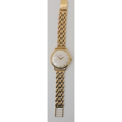 674 - A 9CT GOLD OMEGA AUTOMATIC WRISTWATCH