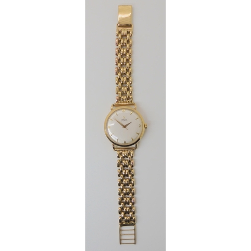 674 - A 9CT GOLD OMEGA AUTOMATIC WRISTWATCH