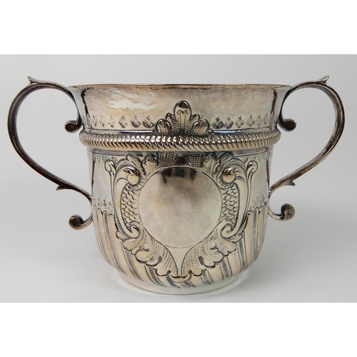 693 - AN EARLY 18TH CENTURY SILVER PORRINGER