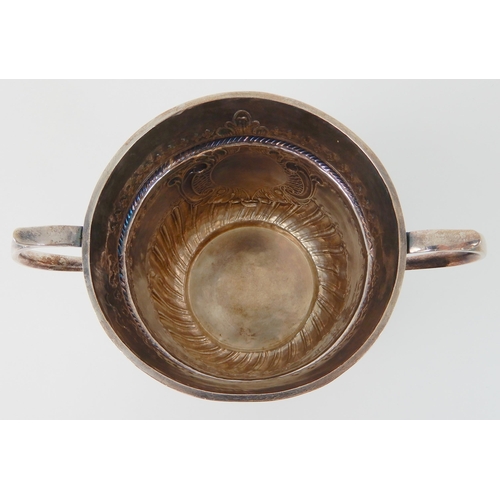 693 - AN EARLY 18TH CENTURY SILVER PORRINGER