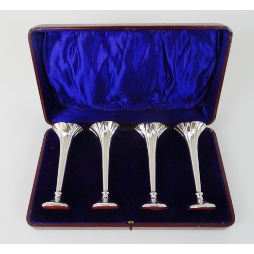 695 - A CASED SET OF FOUR SILVER FLOWER FLUTES