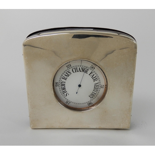 697 - A WHITE METAL CASED BAROMETER