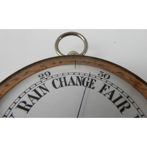 697 - A WHITE METAL CASED BAROMETER