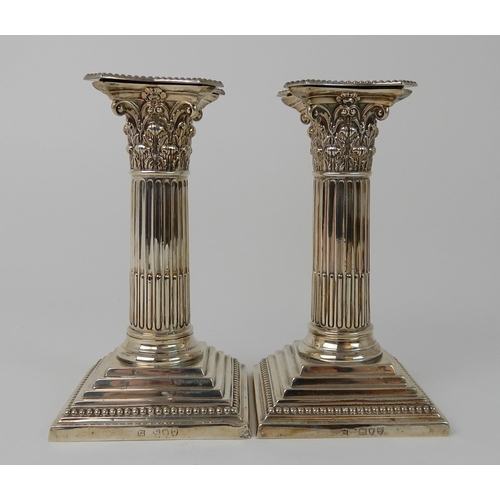 699 - A PAIR OF LATE VICTORIAN SILVER CANDLESTICKS