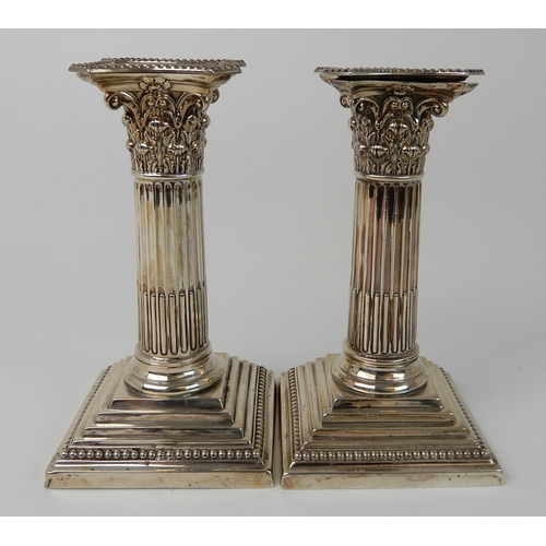 699 - A PAIR OF LATE VICTORIAN SILVER CANDLESTICKS