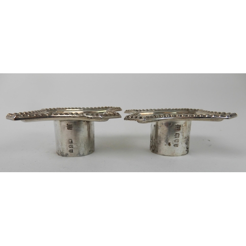 699 - A PAIR OF LATE VICTORIAN SILVER CANDLESTICKS