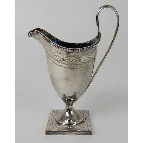 703 - A SILVER CREAM JUG