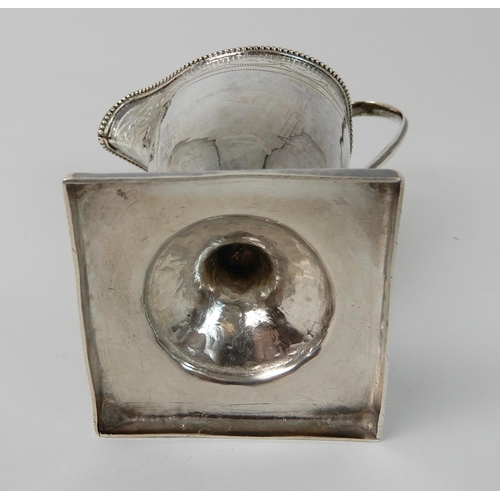 703 - A SILVER CREAM JUG