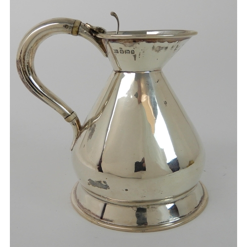 710 - A SILVER HOT WATER JUG