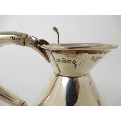 710 - A SILVER HOT WATER JUG