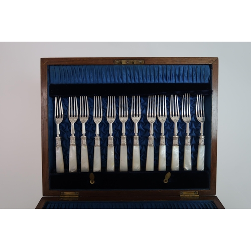 745 - A CASED TWENTY FOUR PIECE SILVER AND MOTHER OF PEARL FRUIT CUTLERY SET