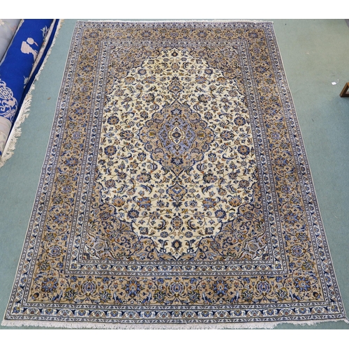 102 - A CREAM GROUND FINE KESHAN RUG