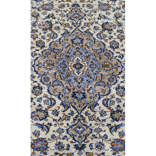 102 - A CREAM GROUND FINE KESHAN RUG