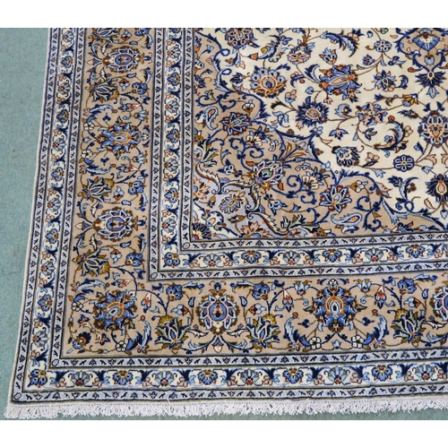 102 - A CREAM GROUND FINE KESHAN RUG