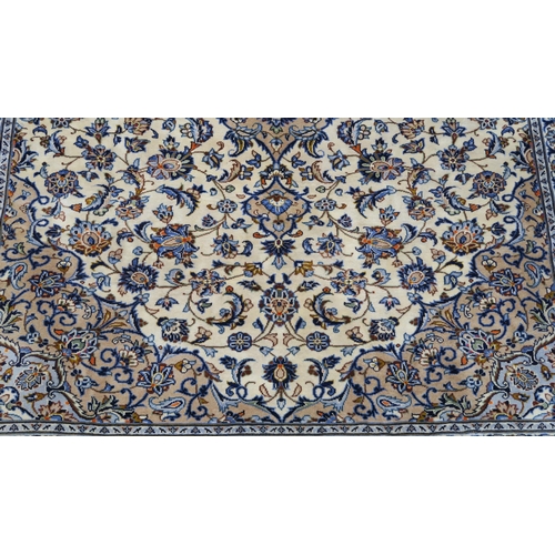 102 - A CREAM GROUND FINE KESHAN RUG