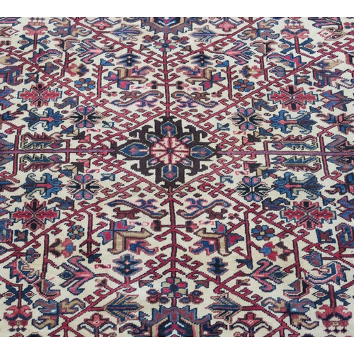 104 - A CREAM GROUND HERIZ RUG