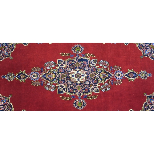 105 - A RED GROUND FINE KESHAN RUG