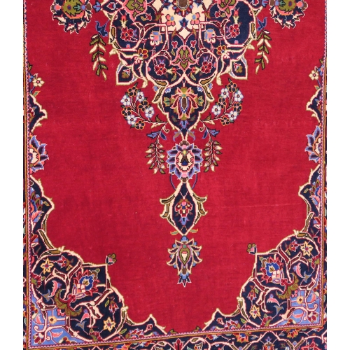 105 - A RED GROUND FINE KESHAN RUG