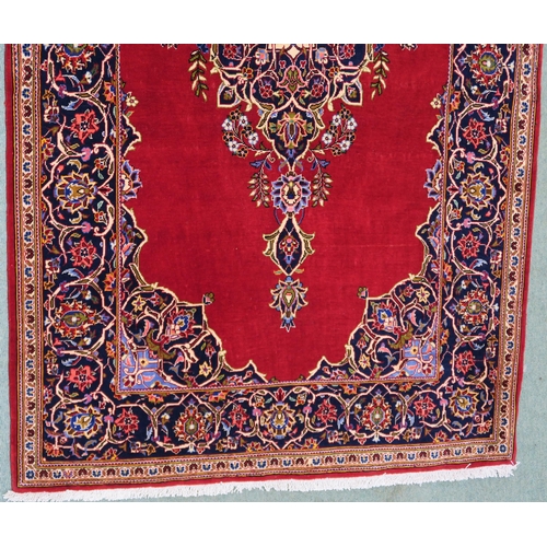 105 - A RED GROUND FINE KESHAN RUG