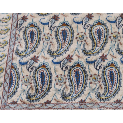 106 - A CREAM GROUND FINE KESHAN RUG