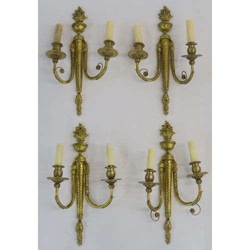 66 - A SET OF FOUR FRENCH GILT METAL WALL SCONCES WITH FLAME FINIALS