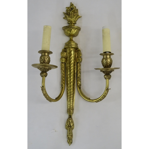 66 - A SET OF FOUR FRENCH GILT METAL WALL SCONCES WITH FLAME FINIALS