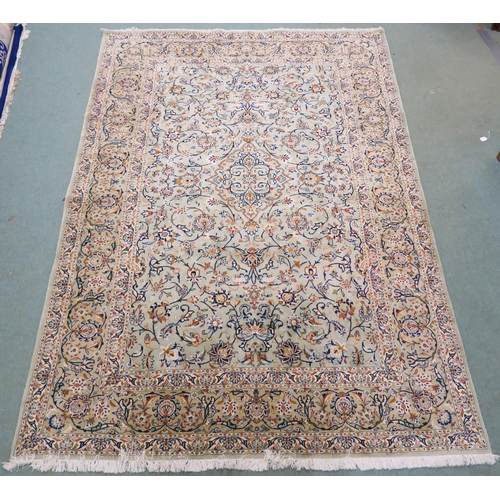 91 - A LIGHT GREEN GROUND KESHAN RUG