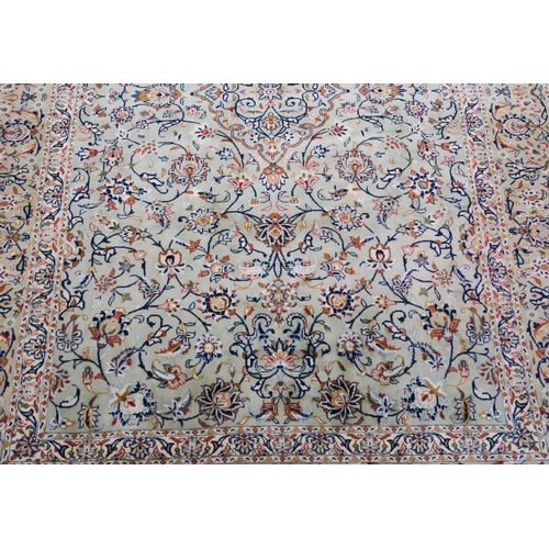 91 - A LIGHT GREEN GROUND KESHAN RUG