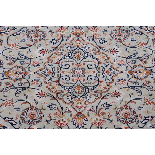 91 - A LIGHT GREEN GROUND KESHAN RUG