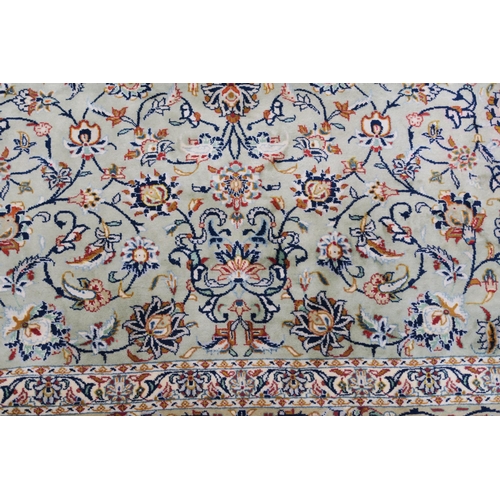 91 - A LIGHT GREEN GROUND KESHAN RUG