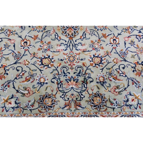 91 - A LIGHT GREEN GROUND KESHAN RUG