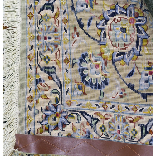 91 - A LIGHT GREEN GROUND KESHAN RUG