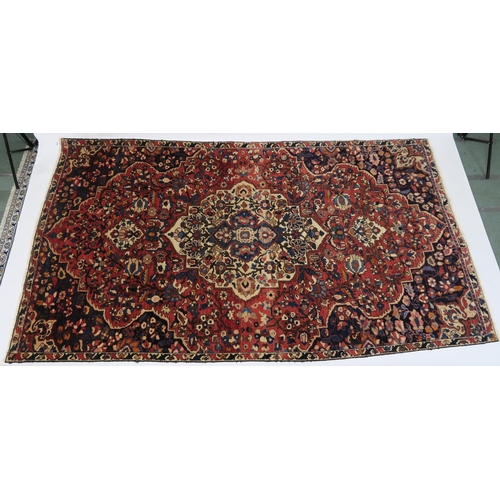 92 - A RED GROUND HAMADAN RUG