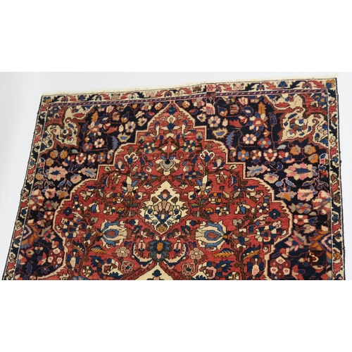 92 - A RED GROUND HAMADAN RUG