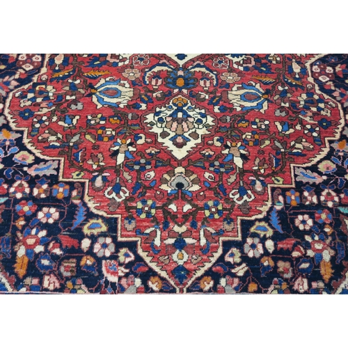 92 - A RED GROUND HAMADAN RUG