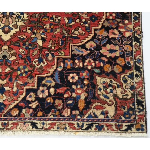 92 - A RED GROUND HAMADAN RUG