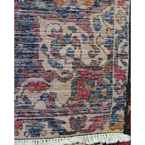 92 - A RED GROUND HAMADAN RUG