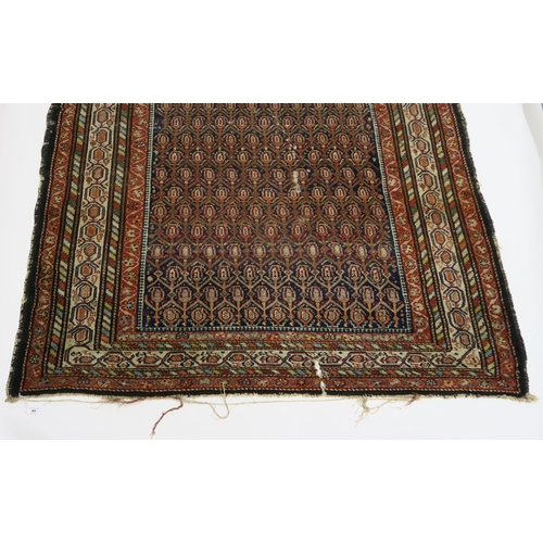 95 - A BLUE GROUND CAUCASIAN RUG