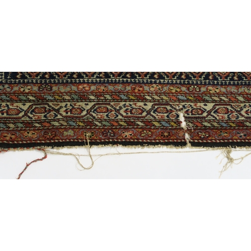 95 - A BLUE GROUND CAUCASIAN RUG