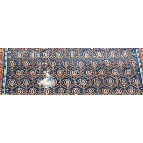 95 - A BLUE GROUND CAUCASIAN RUG