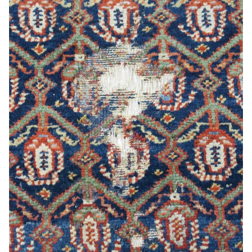 95 - A BLUE GROUND CAUCASIAN RUG