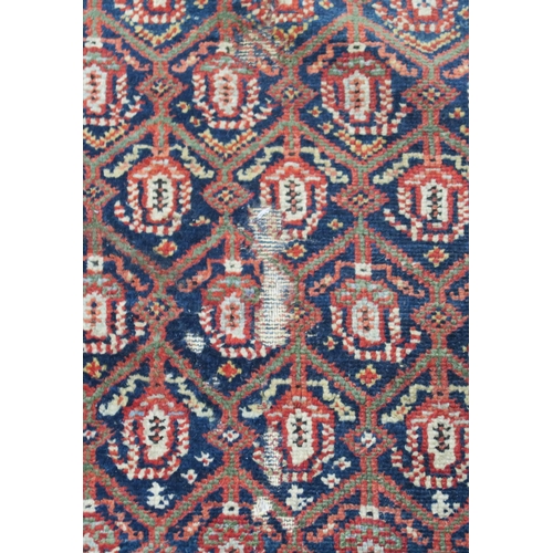 95 - A BLUE GROUND CAUCASIAN RUG