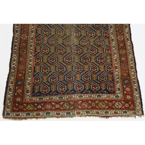 96 - A BLUE GROUND CAUCASIAN RUG