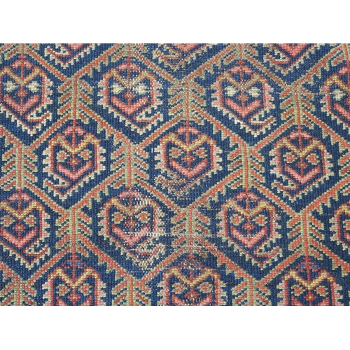 96 - A BLUE GROUND CAUCASIAN RUG