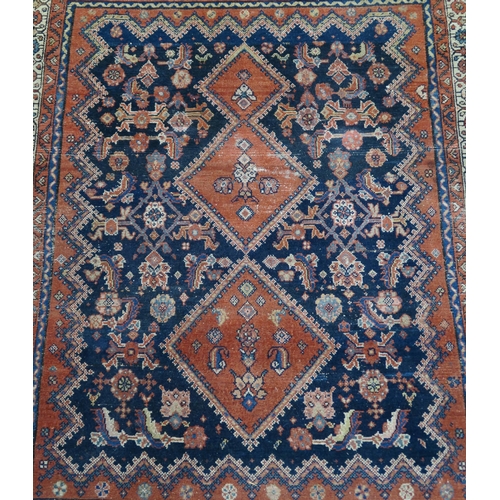 97 - A BLUE GROUND CAUCASIAN RUG