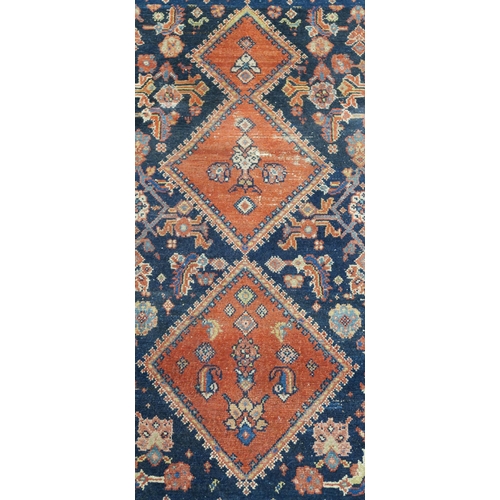 97 - A BLUE GROUND CAUCASIAN RUG